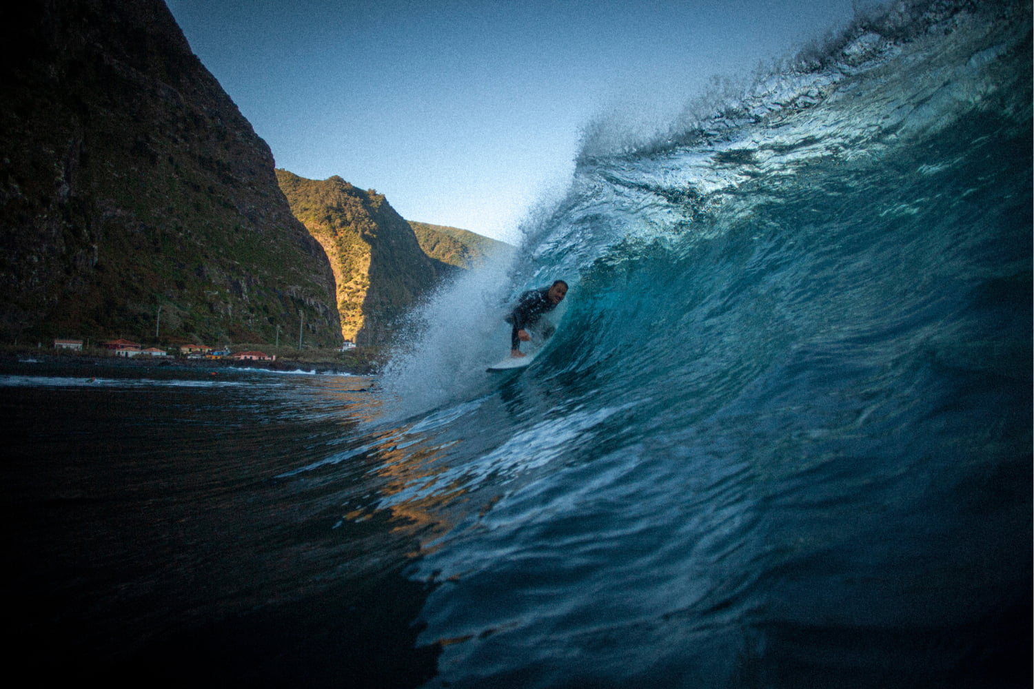 Surfer riding a perfect wave while in a surf guiding session