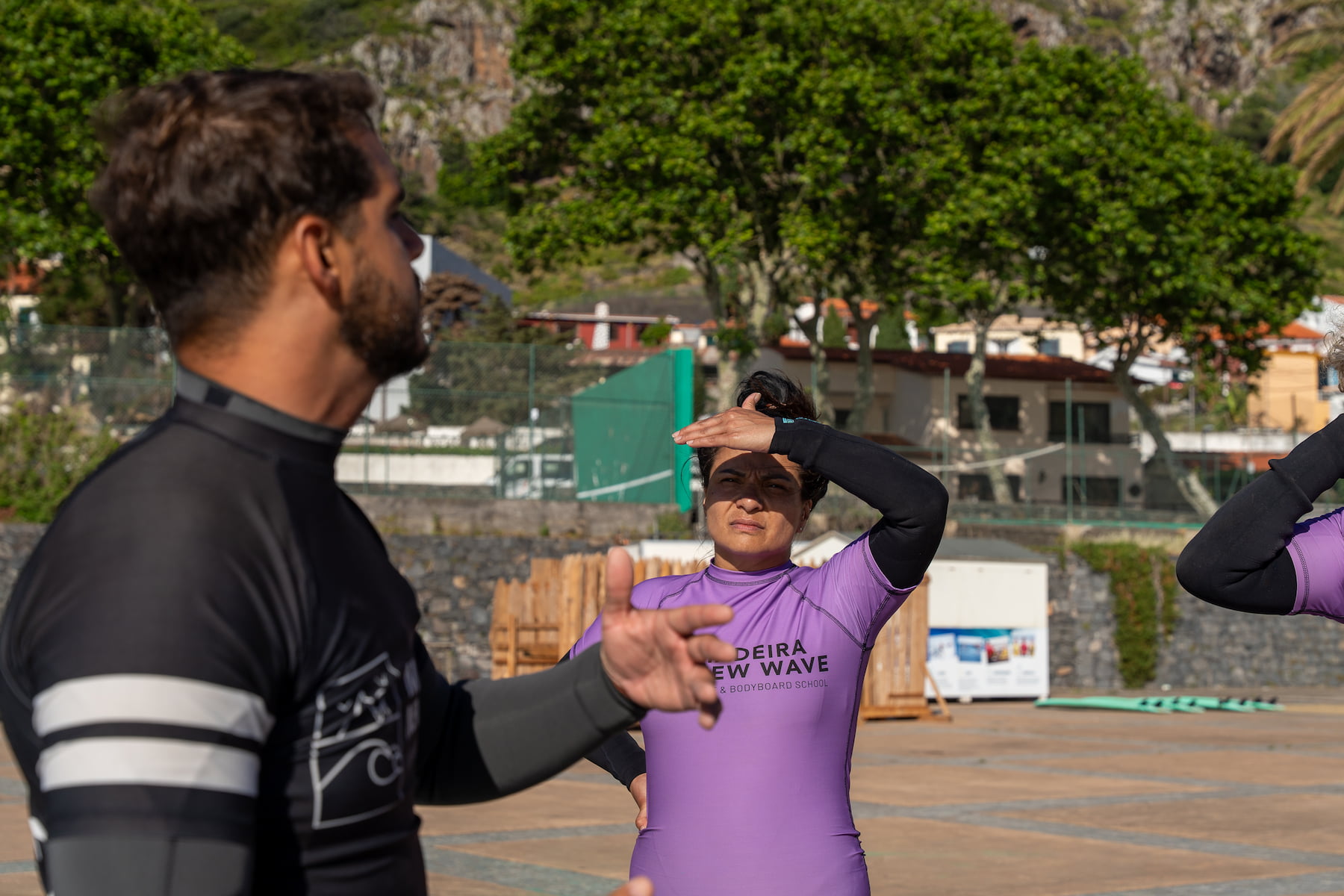 Surf instructor giving tips to the surfers before their surf guiding session