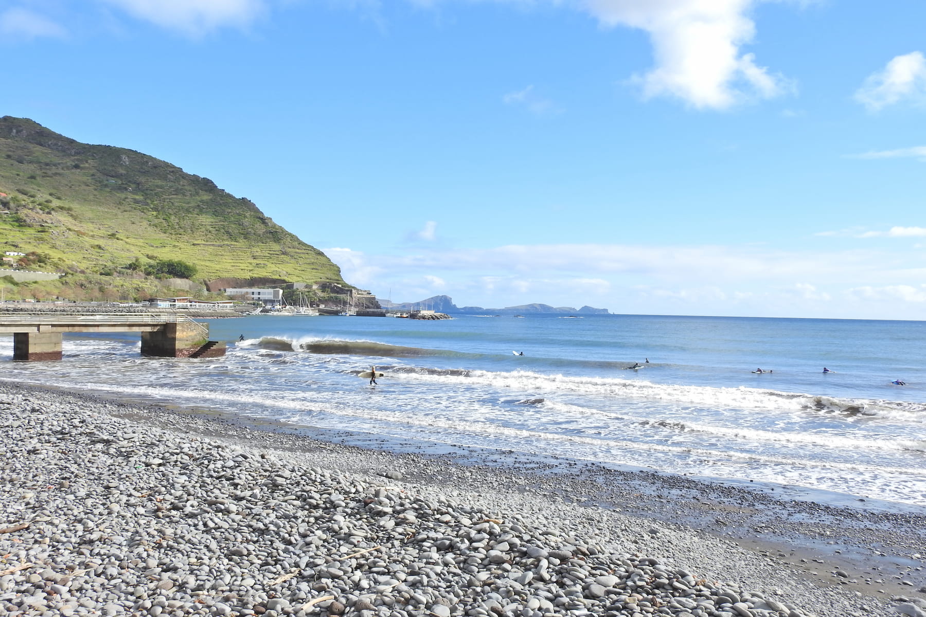 Landscape of machico's beach in a sunny day right before a group bodyboard lesson in madeira starts