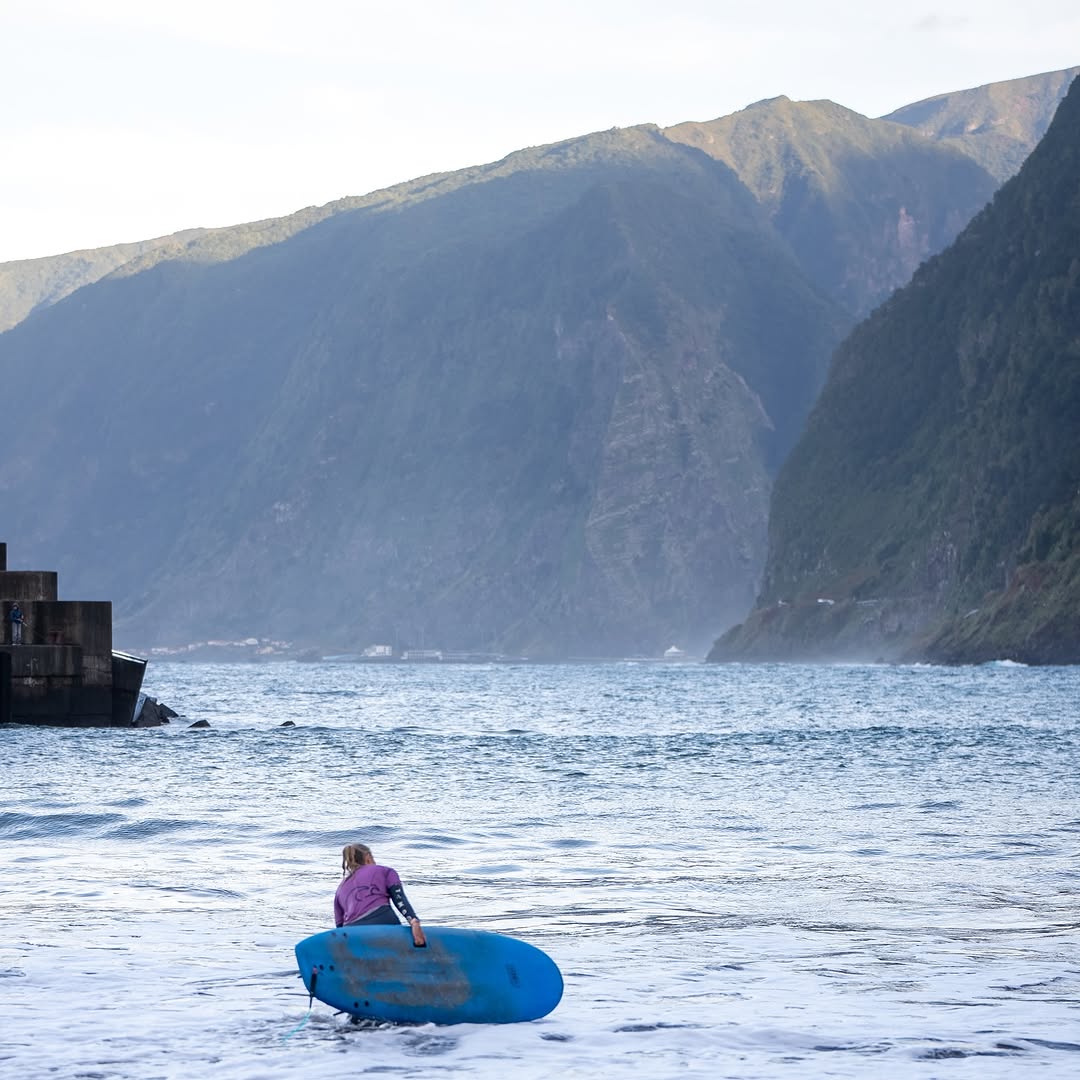 Surfer looking at seixal's landscape while in a surf lesson in seixal