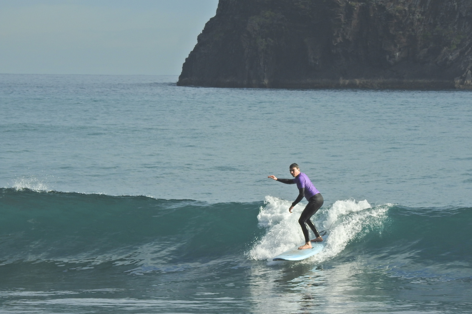Male surfer doing a beginner surf lesson in Porto da Cruz